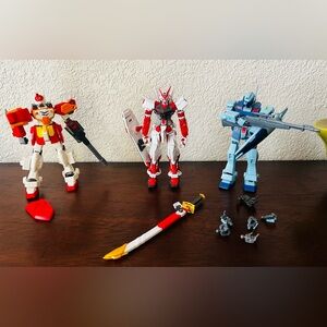 Bandai Gundam Astray Red Frame, Heavyarms Snipper II, and HG Universal Century